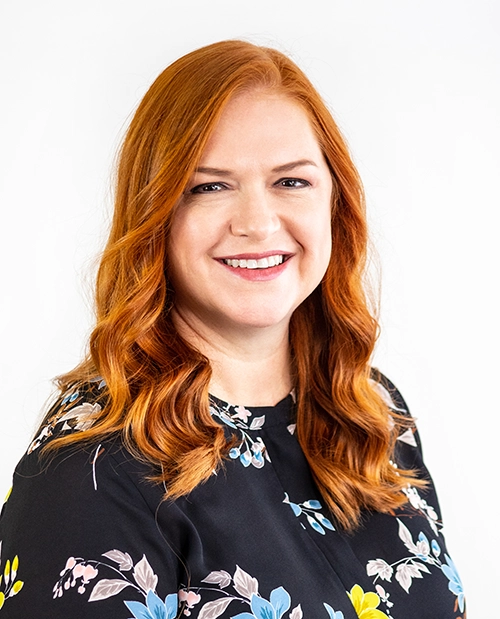 When to Use Dallas Commercial Photography vs. Stock - myheartcreative A professional headshot of a staff member from ChildCare Inc.