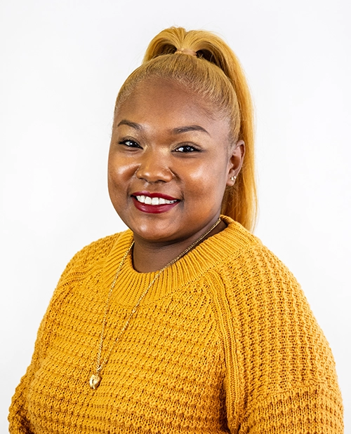 When to Use Dallas Commercial Photography vs. Stock - myheartcreative A professional headshot of a staff member from ChildCare Inc.