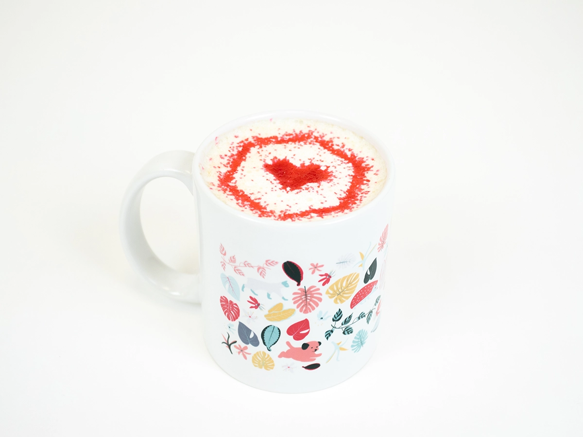 7 Creative Places to Put Your Logo Design Dallas - myheartcreative A cup of coffee with red sprinkles in the shape of the myheartcreative logo.