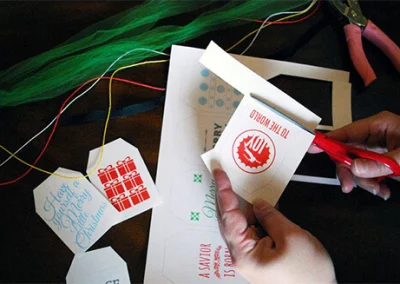 Amy cutting out free Christmas tags.