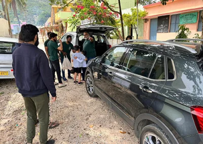 The myheartcreative team unloads donations for a local school in India.