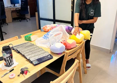A young girl sorts through toy donations in India.