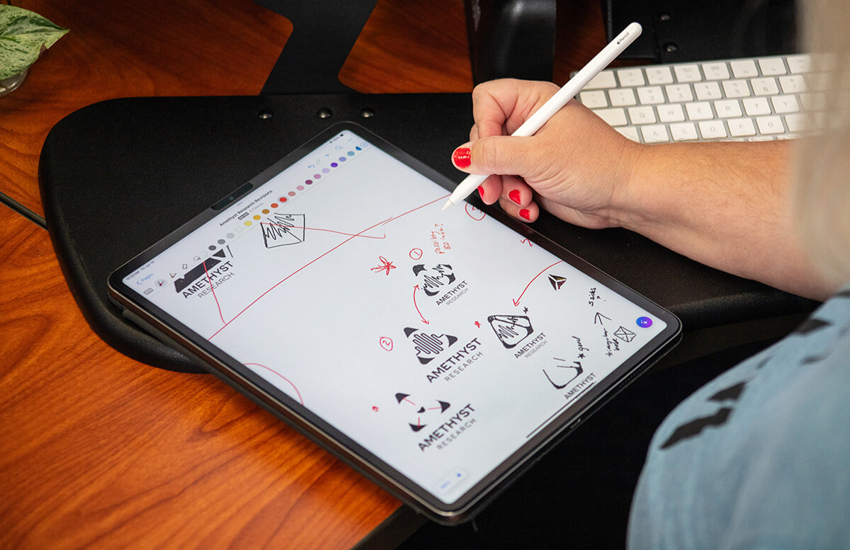 Amy sketching a logo on her iPad