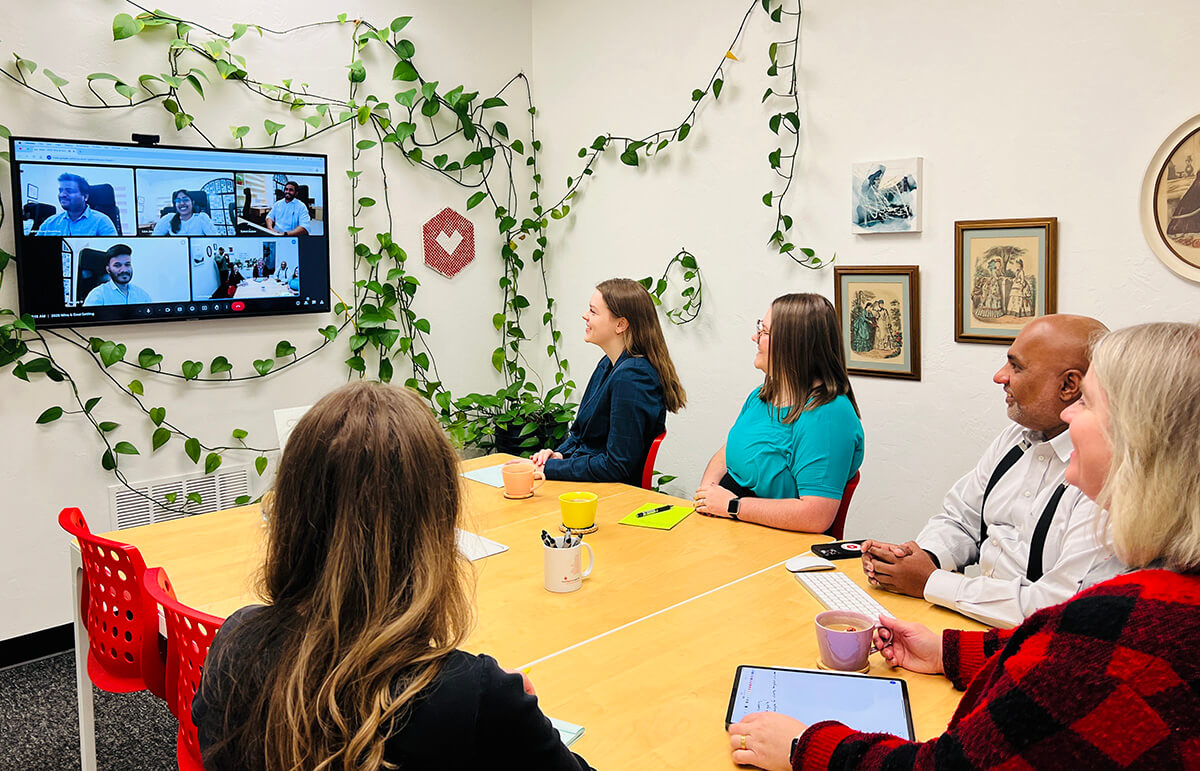 The myheartcreative team in a meeting in the conference room. 