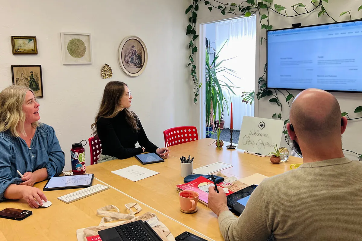 Amy and Kristen in a design meeting with a client.