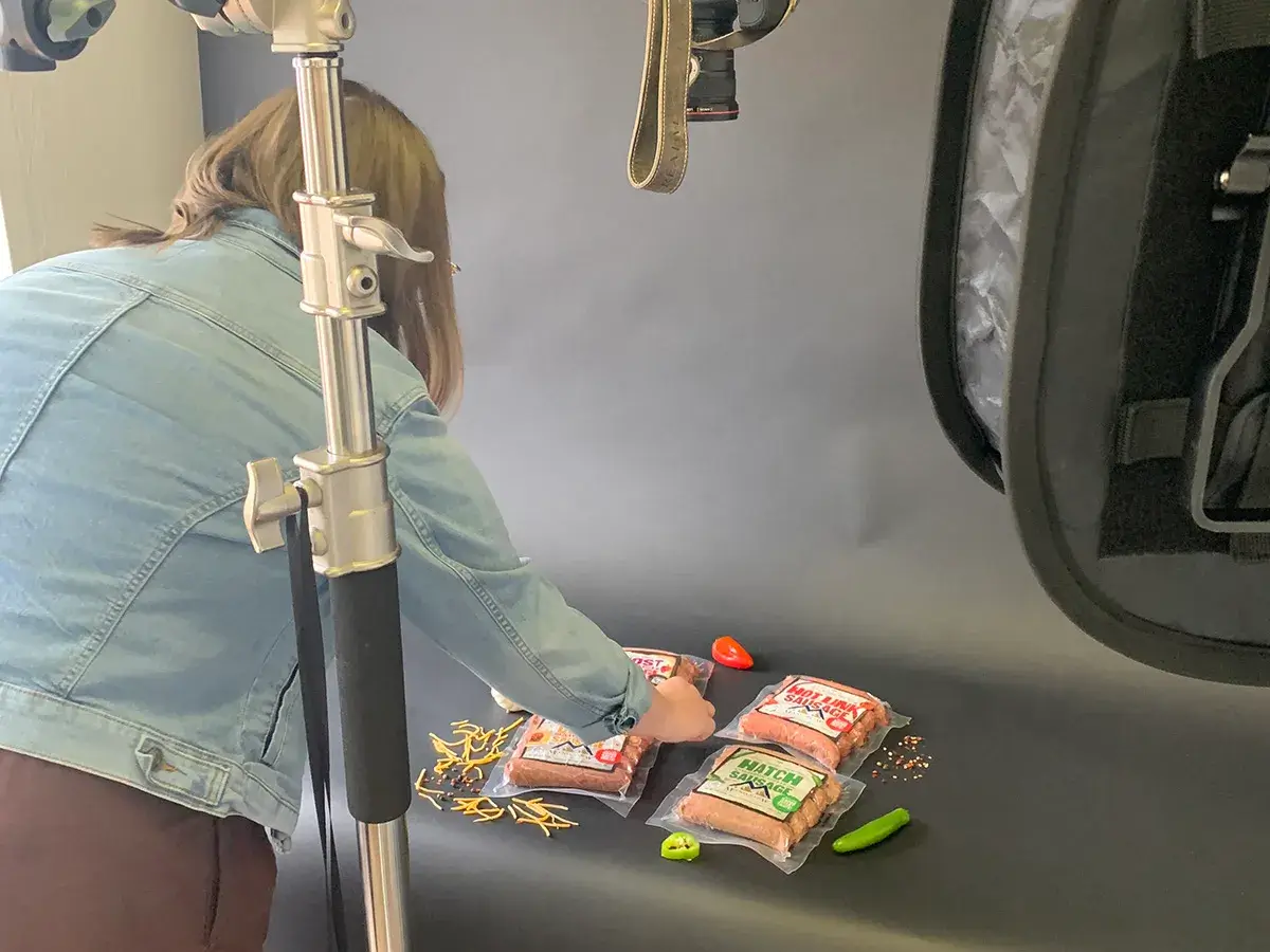 A photographer laying out food for a product photoshoot