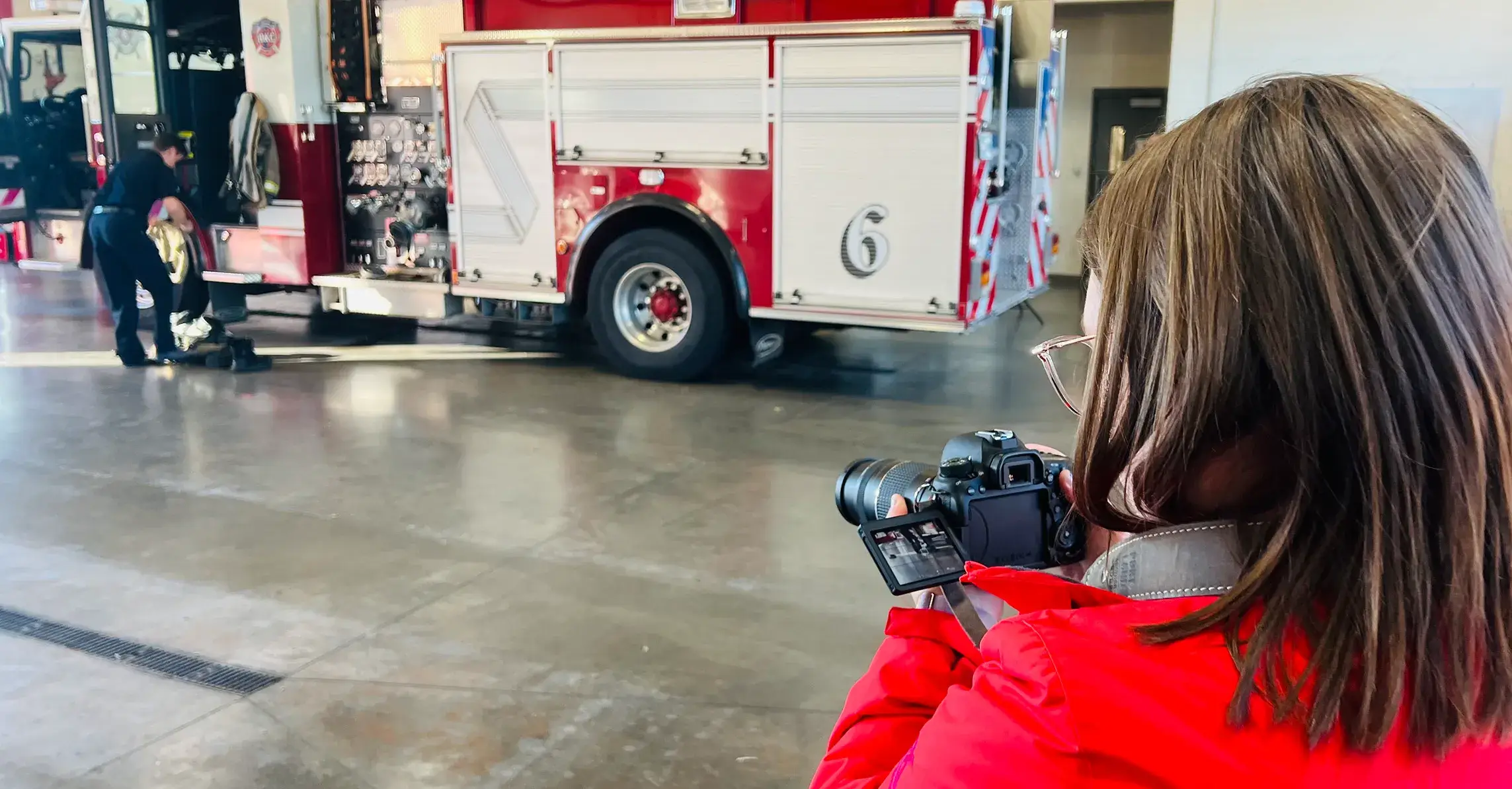 Ready to Create Caitlin taking photos at a firehouse photoshoot