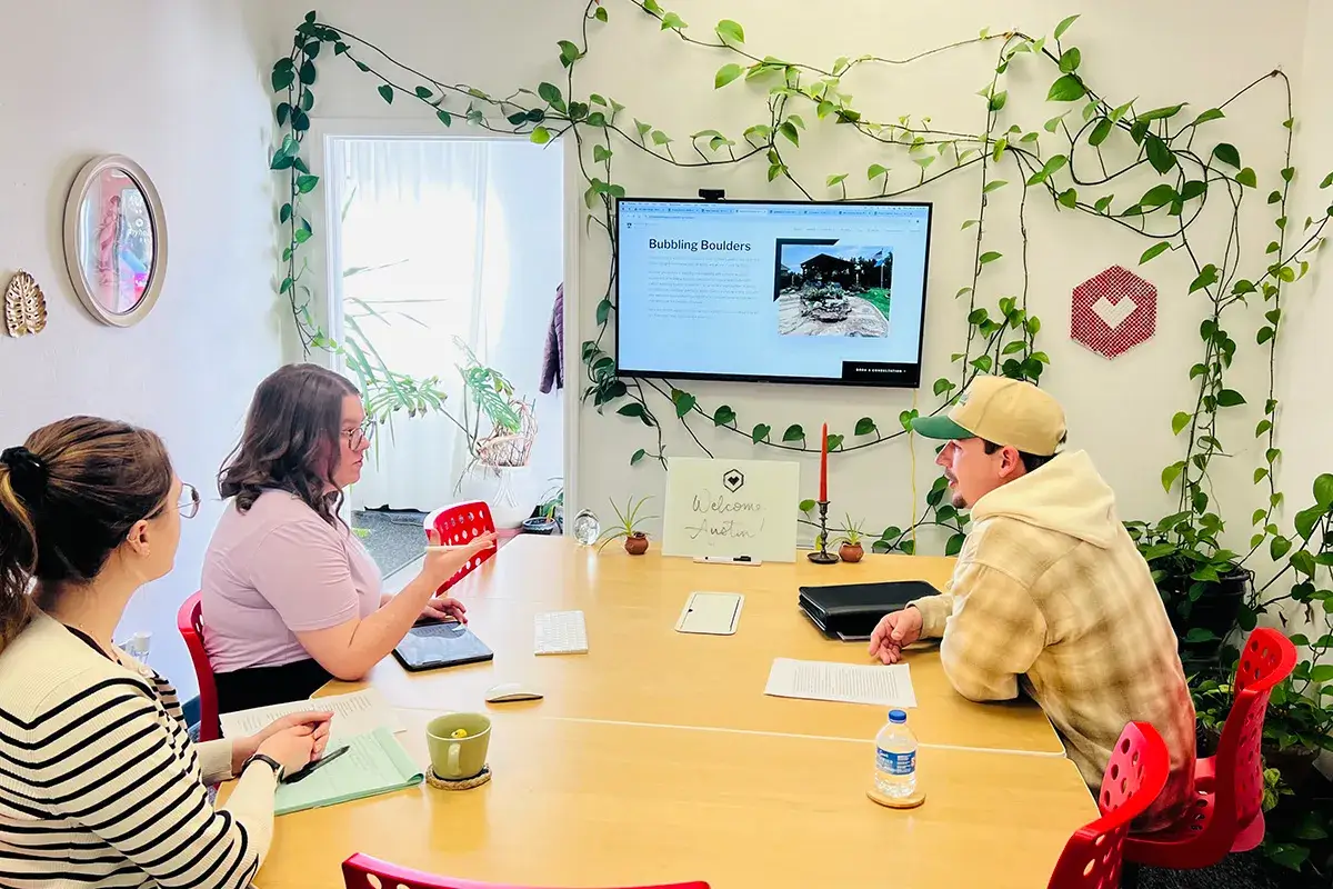 Why Web Design Is Important - myheartcreative Caitlin and Kristen meeting with a client in the conference room