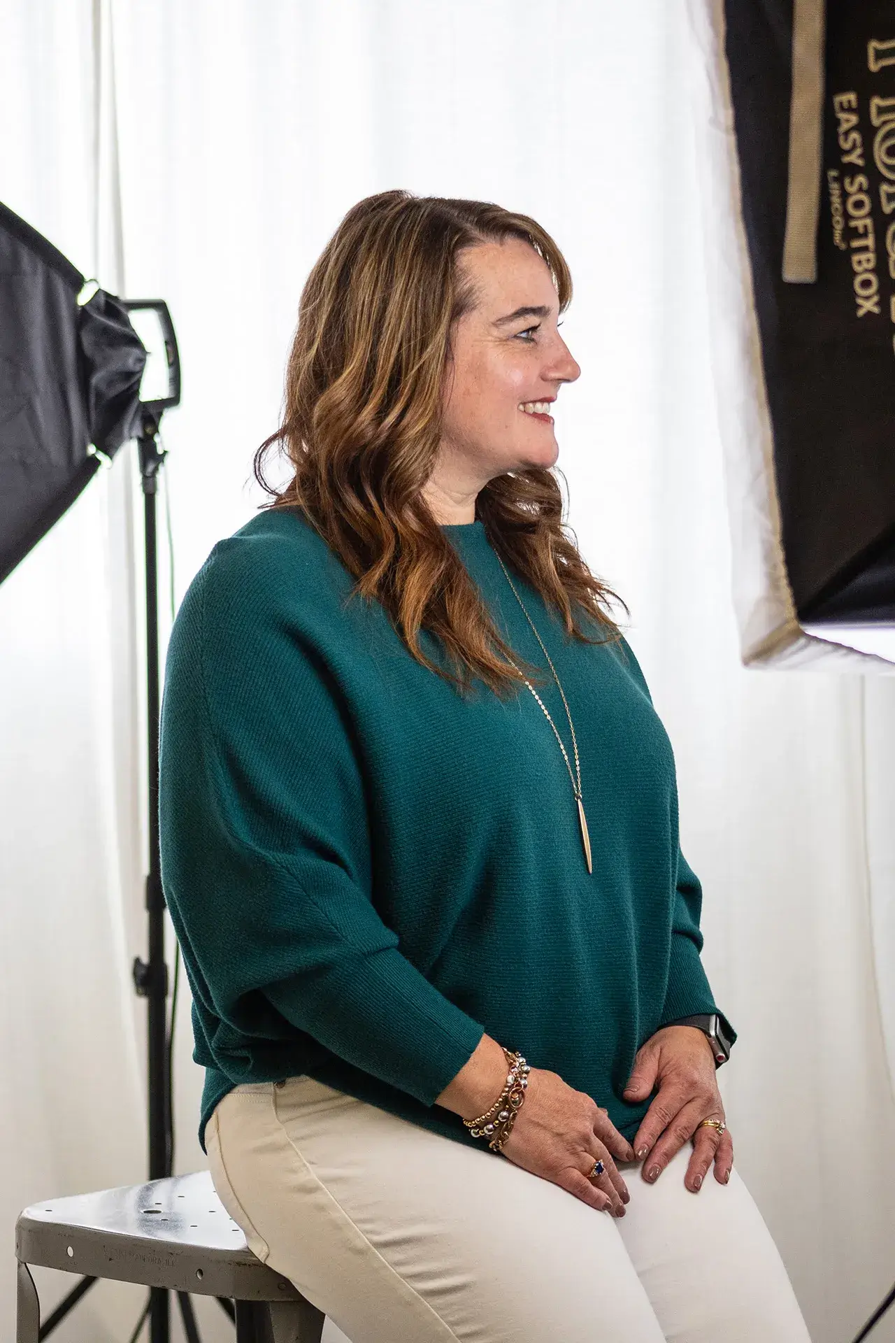 A client sitting and posing for a professional headshot