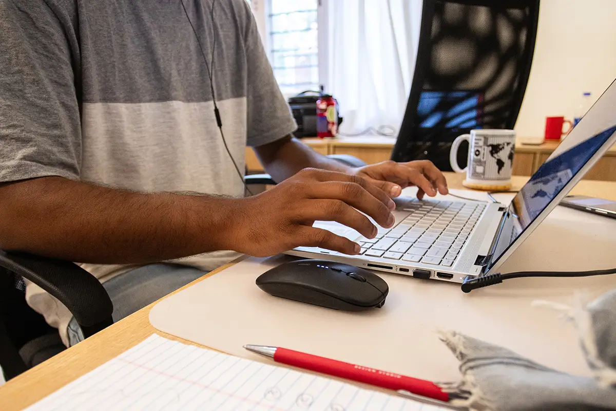 SEO team typing while researching keywords