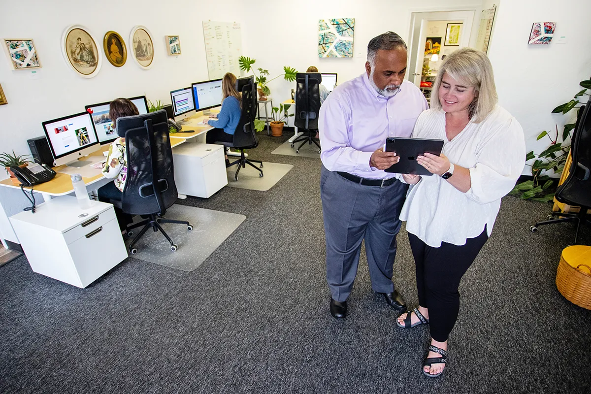 myheartcreative partners looking at a tablet