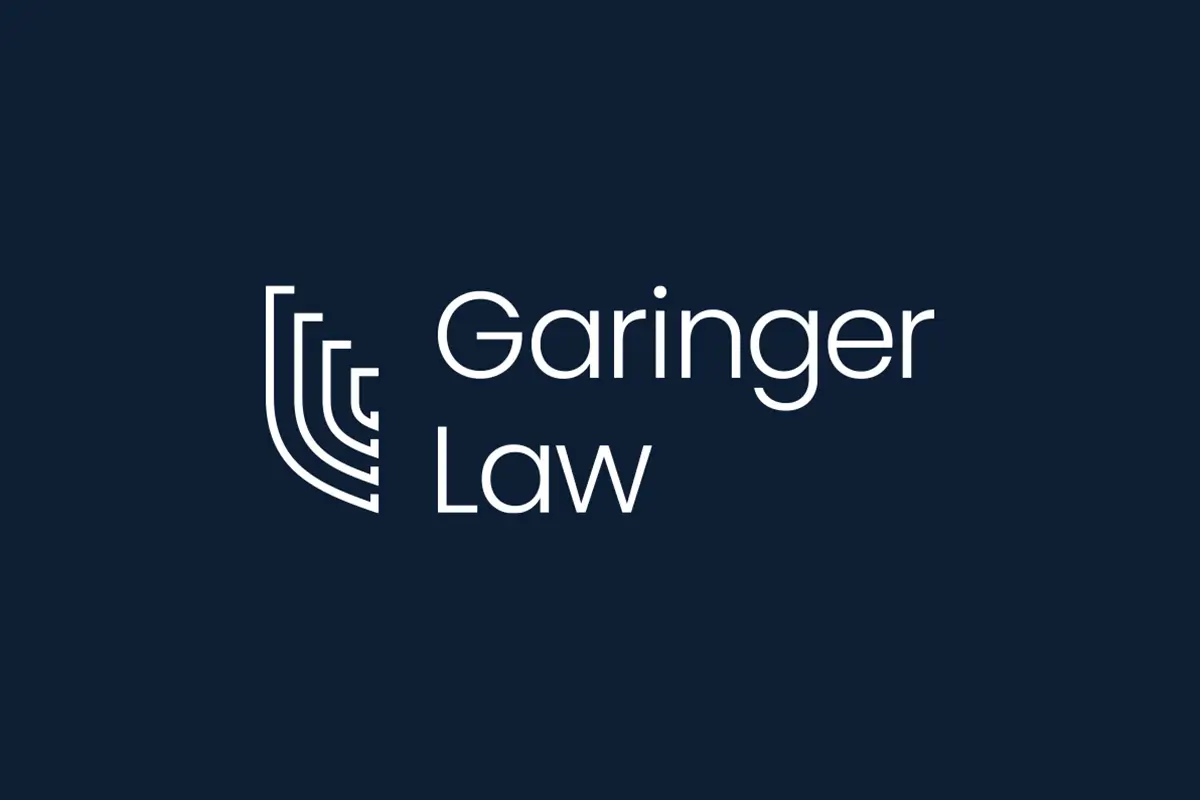Garinger Law logo with modern, minimalist design featuring a stylized abstract icon and clean, white typography on a dark blue background