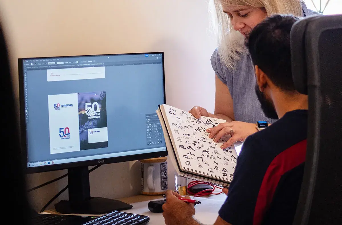 logo-design-oklahoma-header Two designers working on a custom logo design Oklahoma