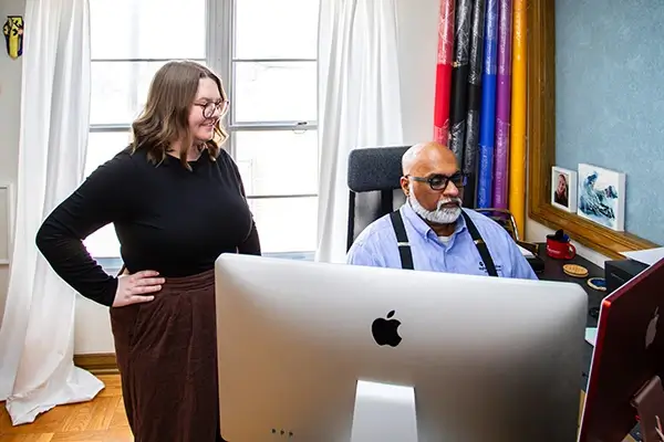 Caitlin and Sam reviewing content