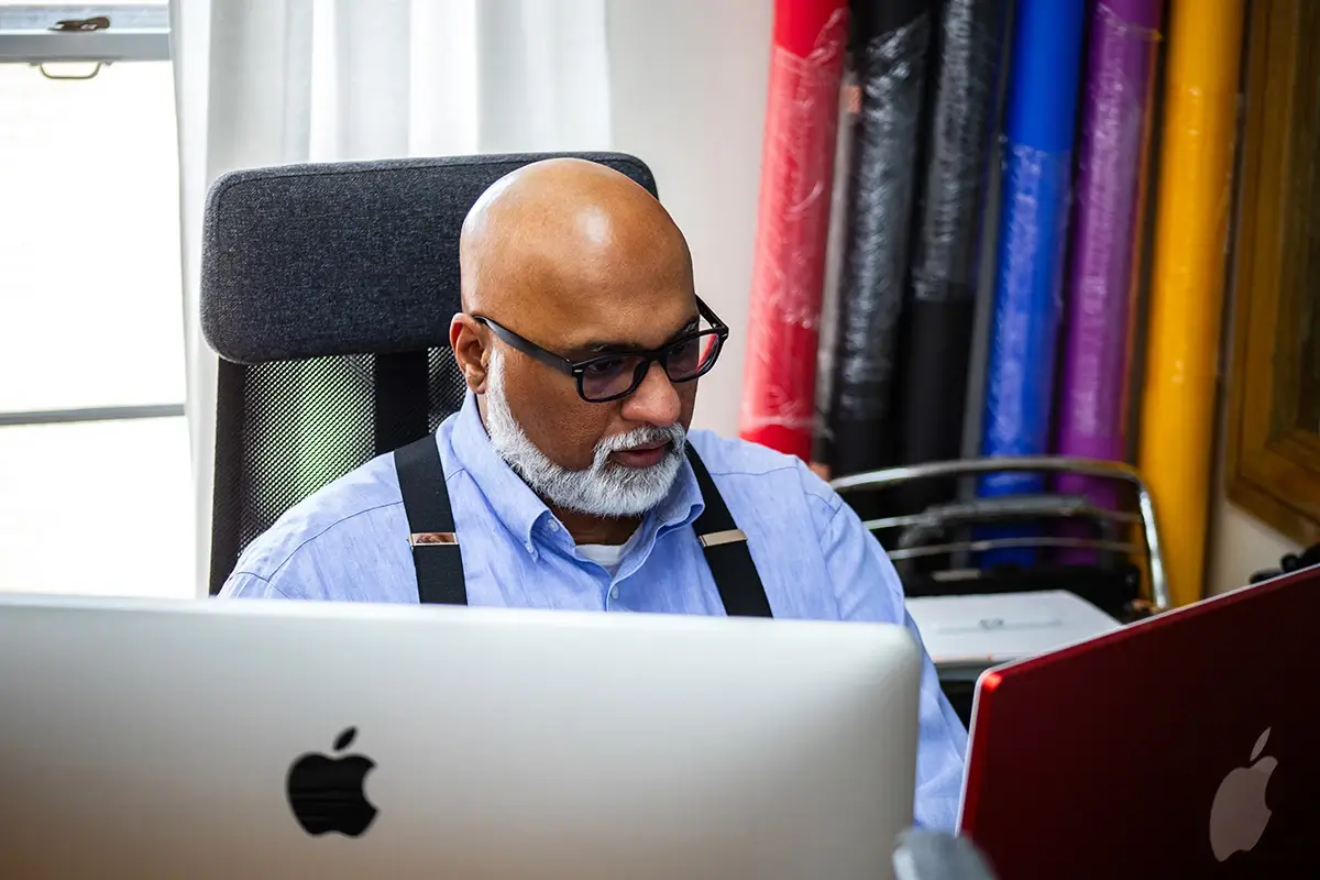 Operations director Sam checking rankings on the computer