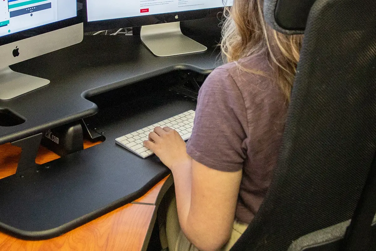 Search Engine Marketing 101 - myheartcreative A woman typing on a keyboard at her desk