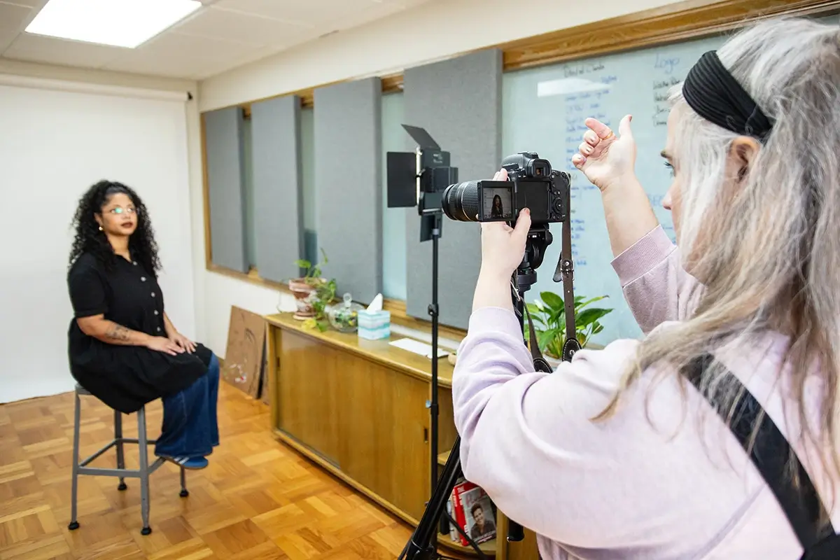 A photographer taking a professional headshot
