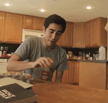 A gif of a man cracking an egg on his table. As soon as the yolk hits the table, it turns into a live baby chick. 