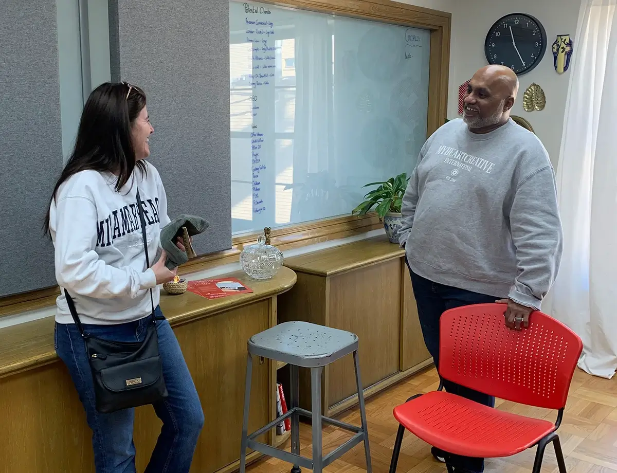 Sam discussing marketing plan with client