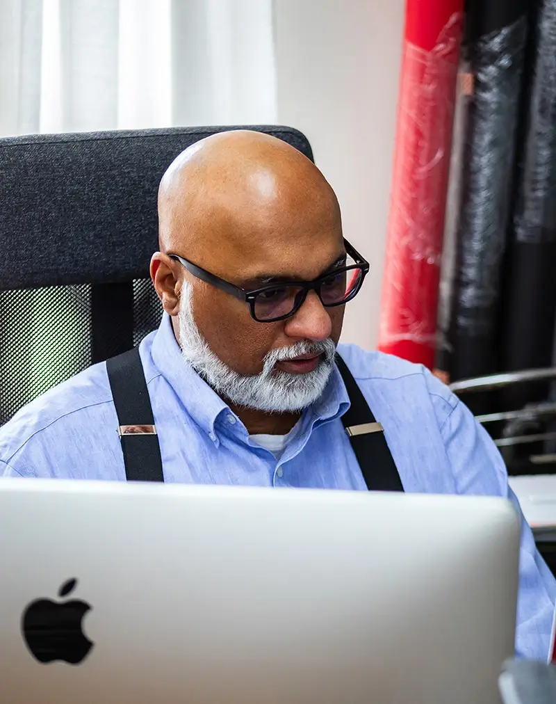 Operations Director Sam researching on computer
