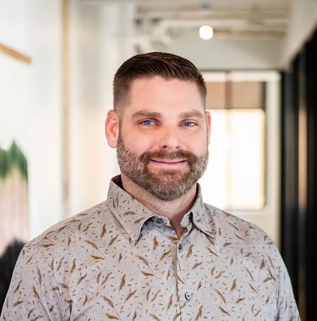 Man smiling in office space