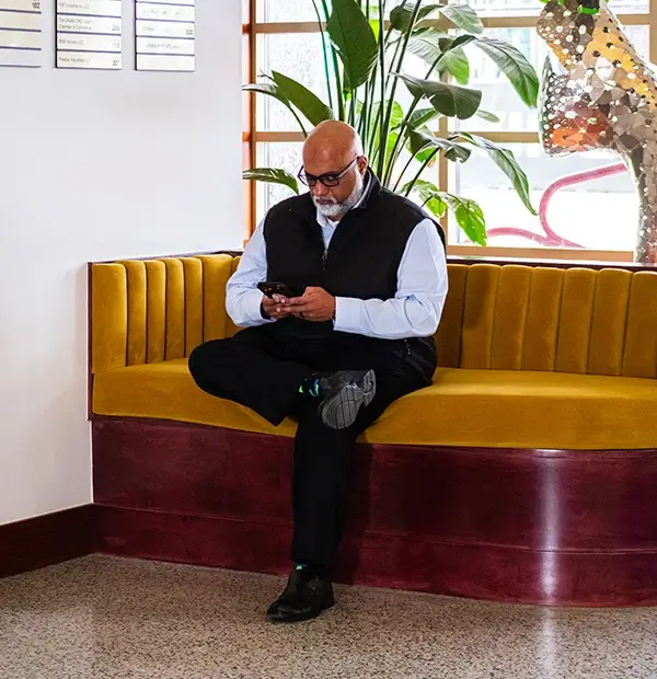 Operations Director reviewing content on phone
